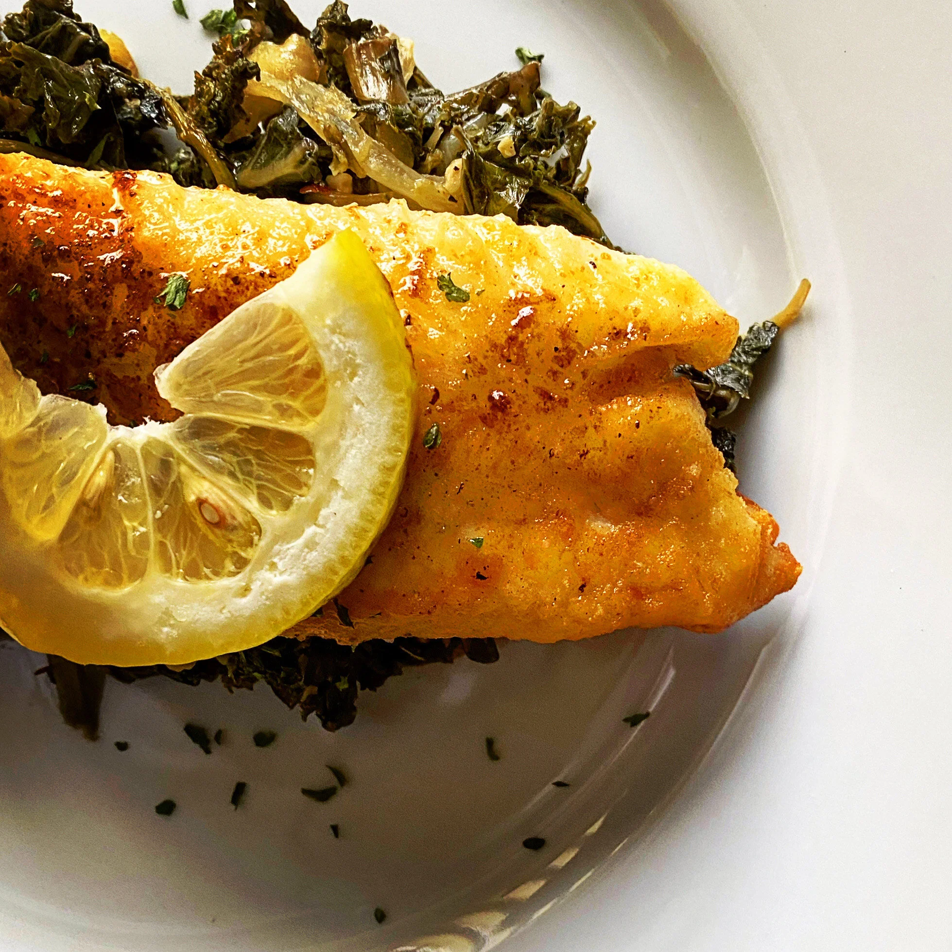 Pan Seared Tilapia in a Lemon Butter Sauce and Saut ed Kale